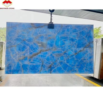 Natürliche durchsichtige blaue Onyx-Steinplatte für Fernsehgeräte Hintergrundwandplatte in goldenem Blau